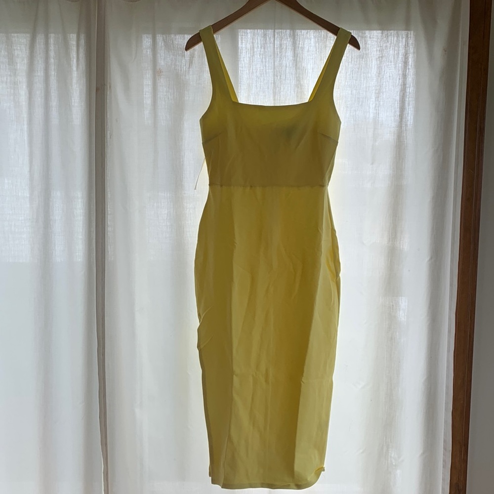 FORE yellow dress size medium. Slit on the side